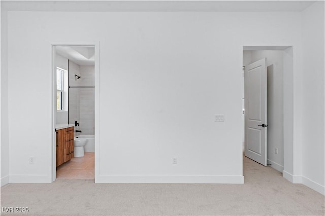 8721 Robinson Ridge Dr, Las Vegas, NV 89117 - unfurnished bedroom with light colored carpet and ensuite bath