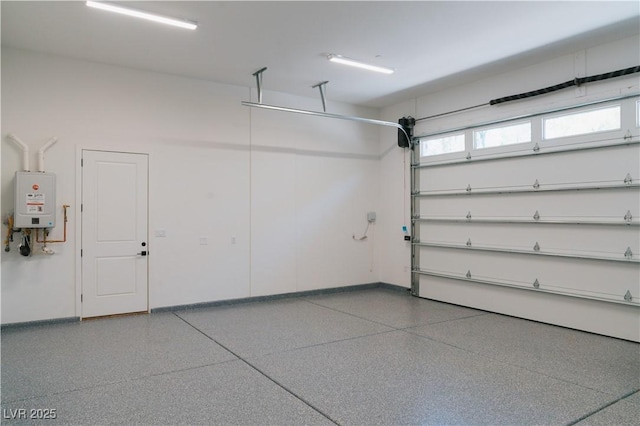8721 Robinson Ridge Dr, Las Vegas, NV 89117 - garage with baseboards and water heater