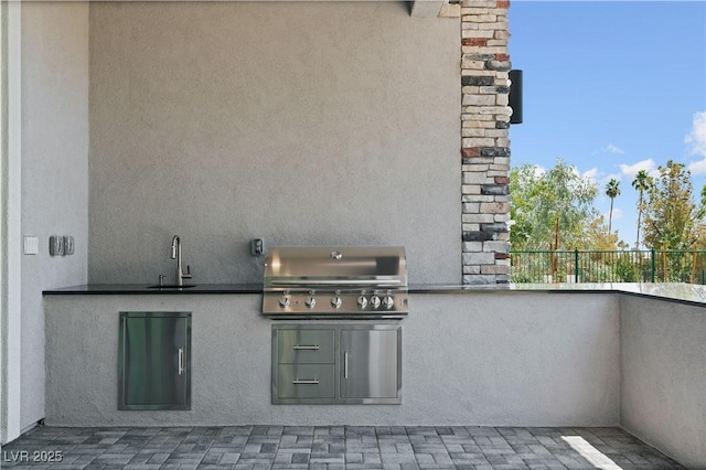 8721 Robinson Ridge Dr, Las Vegas, NV 89117 - view of patio / terrace featuring a sink and area for grilling