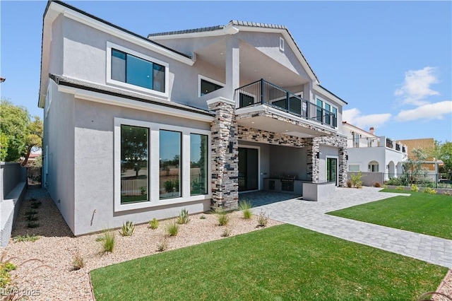 8721 Robinson Ridge Dr, Las Vegas, NV 89117 - back of property featuring a balcony, a patio, and stucco siding