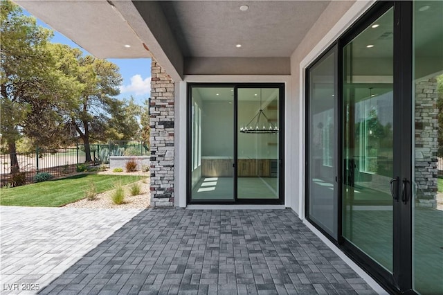 8721 Robinson Ridge Dr, Las Vegas, NV 89117 - property entrance featuring a patio and stone siding