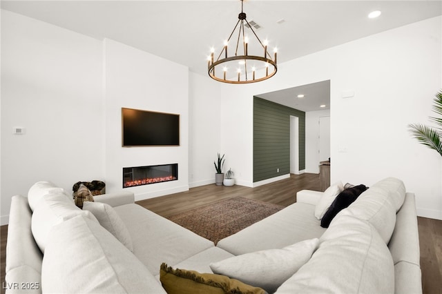 9815 Evergreen Pine St, Las Vegas, NV 89166 - living area with baseboards, wood finished floors, and a chandelier