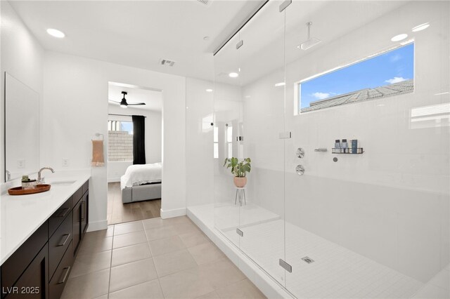 9815 Evergreen Pine St, Las Vegas, NV 89166 - bathroom featuring visible vents, tile patterned floors, a ceiling fan, a shower with shower door, and ensuite bath