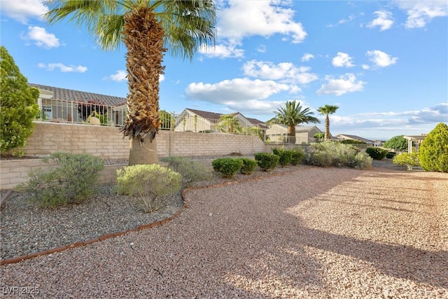 view of yard with fence and a residential view