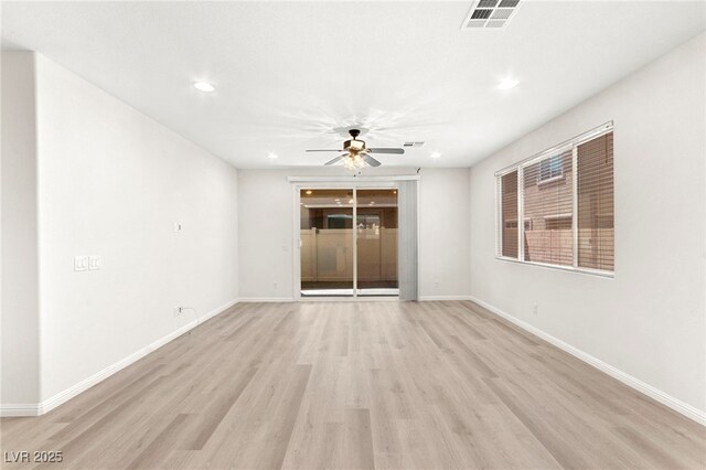 unfurnished room featuring ceiling fan, recessed lighting, baseboards, light wood-type flooring, and visible vents