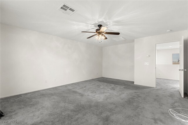 unfurnished room with visible vents, carpet, and ceiling fan