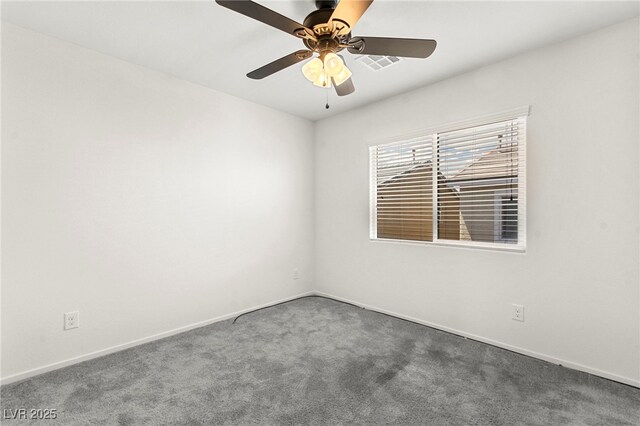 carpeted empty room featuring baseboards, ceiling fan, and visible vents