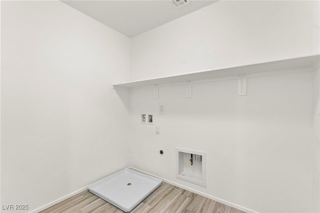 washroom with washer hookup, laundry area, light wood-style flooring, gas dryer hookup, and baseboards