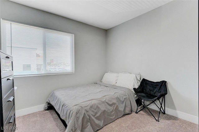 bedroom featuring baseboards and carpet floors