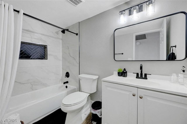 bathroom featuring toilet, shower / tub combo with curtain, vanity, and visible vents