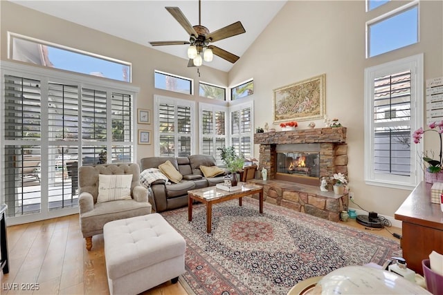 2909 Sterling Cove Dr, Las Vegas, NV 89128 - living area with a fireplace, ceiling fan, high vaulted ceiling, and hardwood / wood-style floors