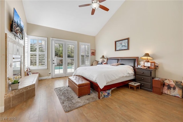 2909 Sterling Cove Dr, Las Vegas, NV 89128 - bedroom with ceiling fan, access to exterior, high vaulted ceiling, baseboards, and light wood-style floors