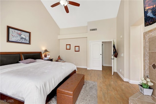 2909 Sterling Cove Dr, Las Vegas, NV 89128 - bedroom featuring ceiling fan, visible vents, high vaulted ceiling, baseboards, and light wood-style flooring