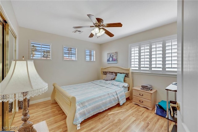 2909 Sterling Cove Dr, Las Vegas, NV 89128 - bedroom featuring ceiling fan, visible vents, wood finished floors, baseboards, and a closet