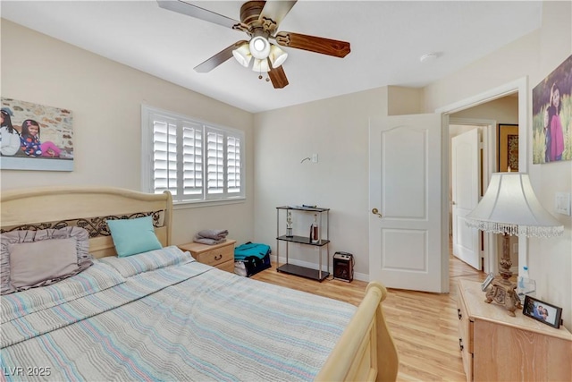 2909 Sterling Cove Dr, Las Vegas, NV 89128 - bedroom with a ceiling fan and light wood finished floors