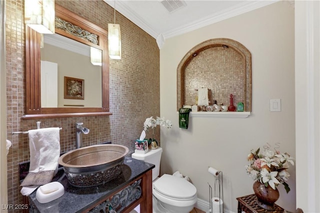 2909 Sterling Cove Dr, Las Vegas, NV 89128 - bathroom with visible vents, tasteful backsplash, vanity, toilet, and ornamental molding