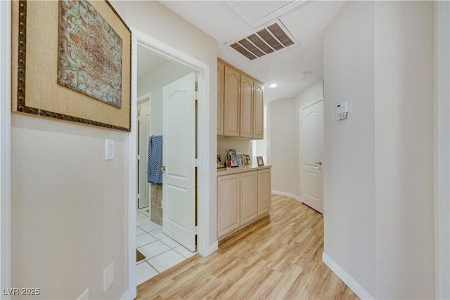 2909 Sterling Cove Dr, Las Vegas, NV 89128 - corridor with baseboards, visible vents, and light wood-style flooring