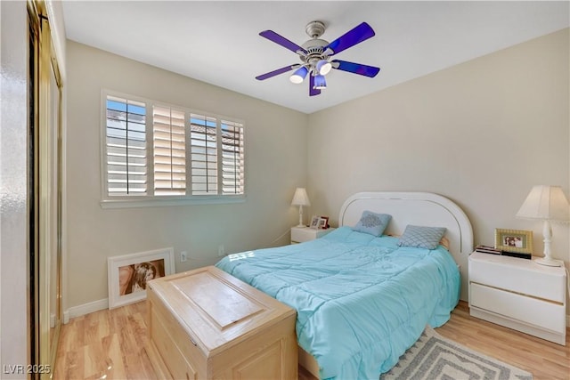 2909 Sterling Cove Dr, Las Vegas, NV 89128 - bedroom featuring a ceiling fan, baseboards, and light wood-type flooring