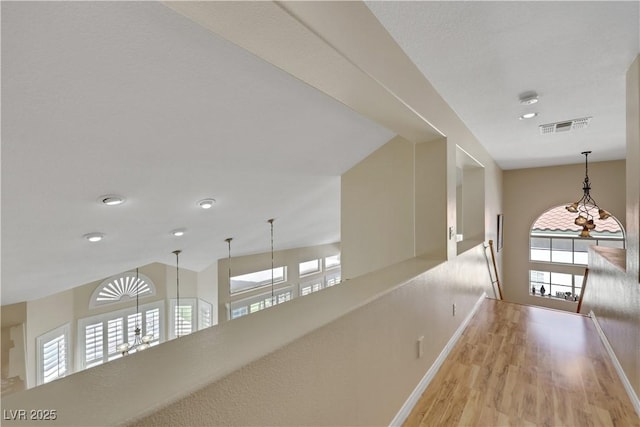 2909 Sterling Cove Dr, Las Vegas, NV 89128 - corridor with visible vents, wood finished floors, baseboards, an upstairs landing, and recessed lighting