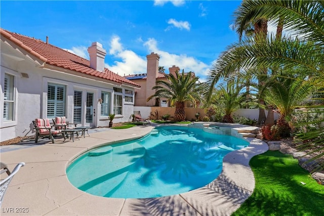 2909 Sterling Cove Dr, Las Vegas, NV 89128 - view of swimming pool with a pool with connected hot tub, a fenced backyard, and a patio area