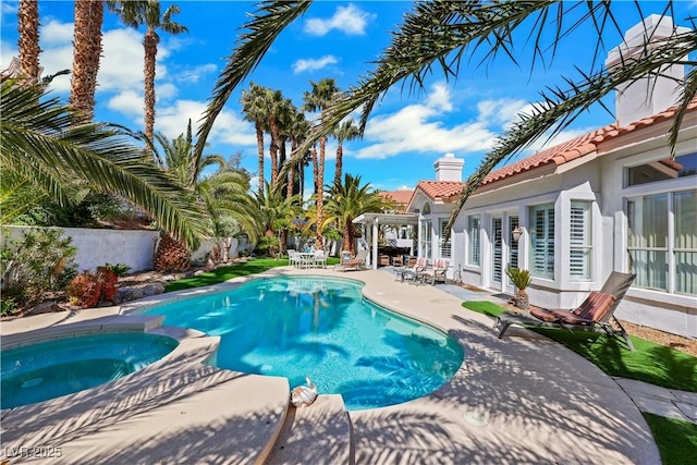 2909 Sterling Cove Dr, Las Vegas, NV 89128 - view of swimming pool with a pool with connected hot tub and a patio area