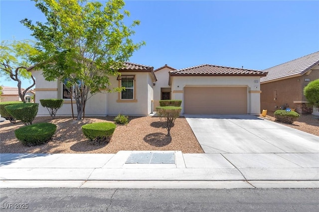 mediterranean / spanish house featuring stucco siding, an attached garage, driveway, and a tile roof