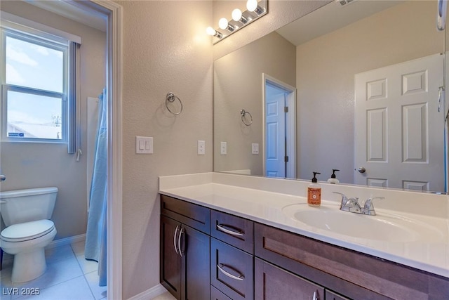 full bath with vanity, baseboards, tile patterned flooring, and toilet