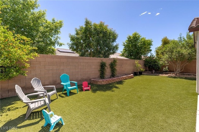 view of yard with a fenced backyard