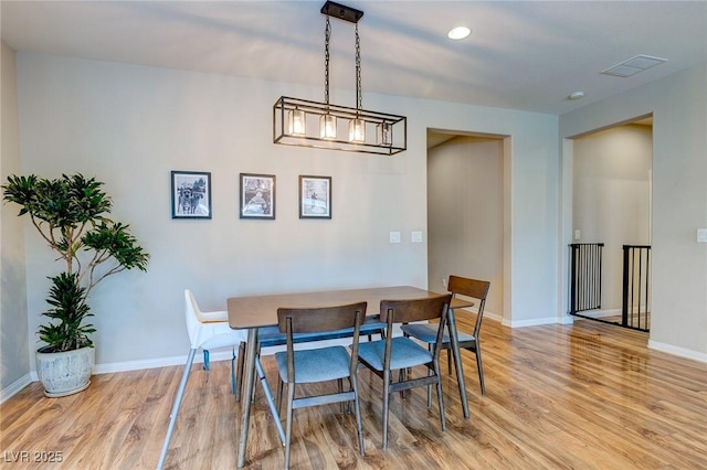 dining space featuring recessed lighting, baseboards, light wood finished floors, and visible vents