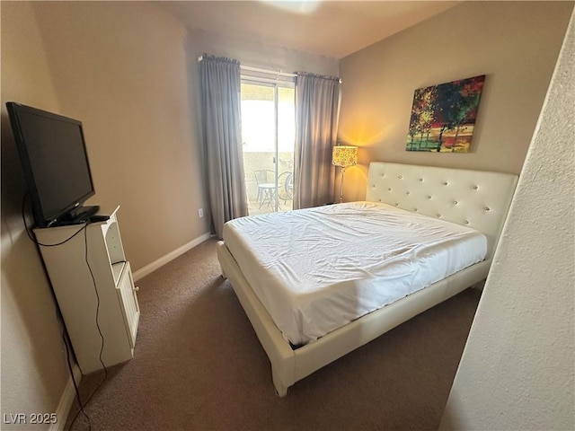 698 S Racetrack Rd Unit 322, Henderson, NV 89015 - carpeted bedroom featuring access to outside and baseboards