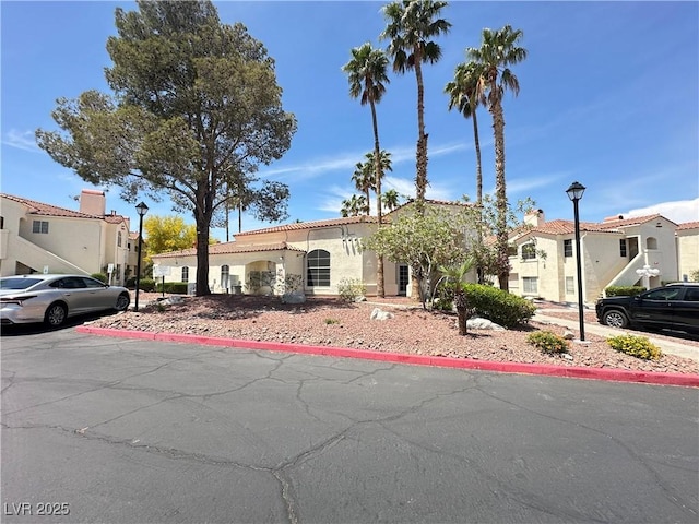 698 S Racetrack Rd Unit 322, Henderson, NV 89015 - mediterranean / spanish home with a residential view, stucco siding, and a tile roof