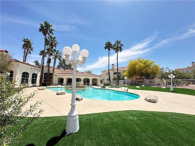 698 S Racetrack Rd Unit 322, Henderson, NV 89015 - view of swimming pool featuring a fenced in pool, fence, a yard, and a patio