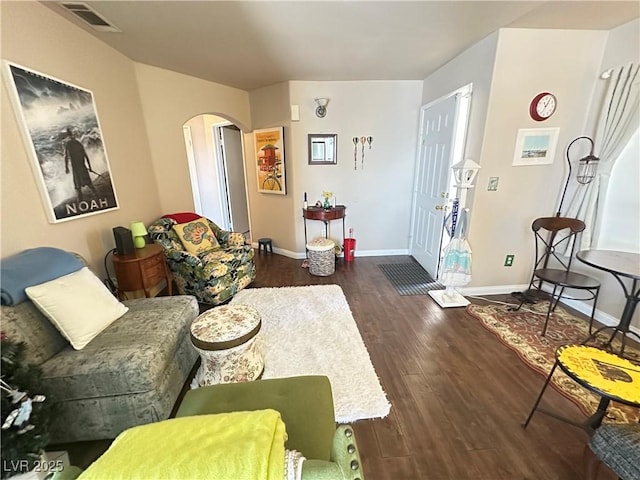 698 S Racetrack Rd Unit 322, Henderson, NV 89015 - living room featuring arched walkways, baseboards, wood finished floors, and visible vents