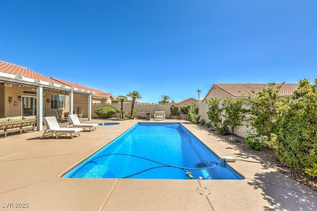 view of pool featuring a fenced backyard, a fenced in pool, and a patio area