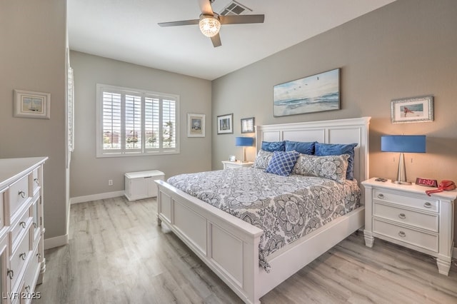 bedroom featuring baseboards, a ceiling fan, light wood finished floors, and visible vents