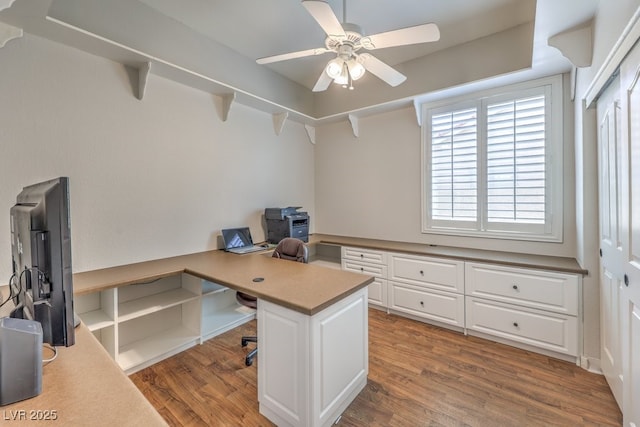 home office with a ceiling fan and wood finished floors