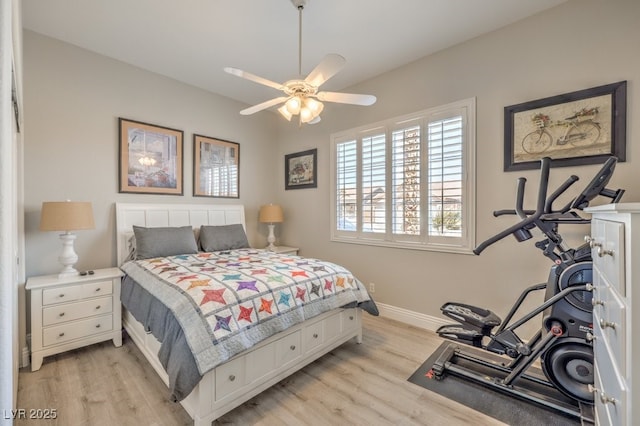 bedroom featuring light wood-style floors and baseboards