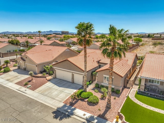 drone / aerial view with a residential view and a mountain view