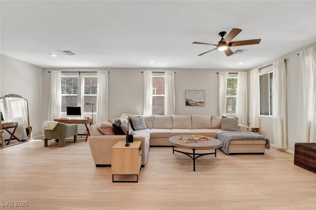 living room with recessed lighting, ceiling fan, visible vents, and light wood-style flooring