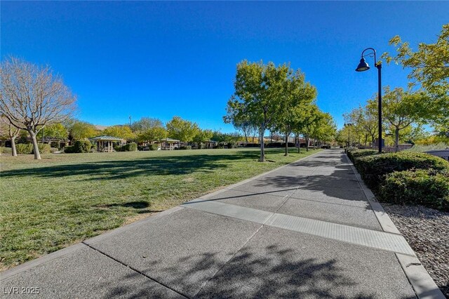 view of property's community with a lawn