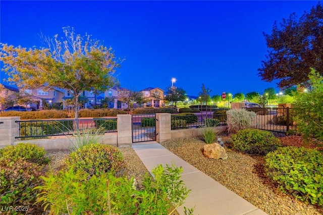 exterior space featuring a gate and a fenced front yard