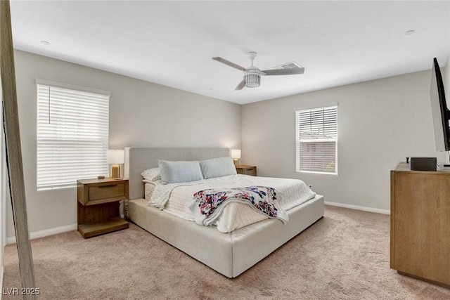 carpeted bedroom featuring a ceiling fan, baseboards, and visible vents