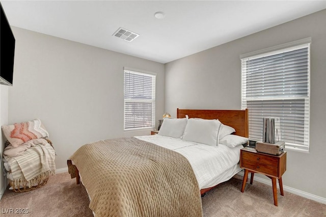 bedroom featuring carpet flooring, baseboards, and visible vents