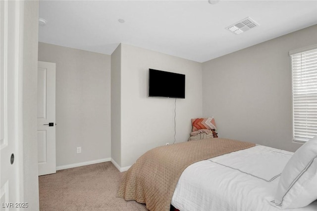 bedroom with visible vents, baseboards, and carpet floors