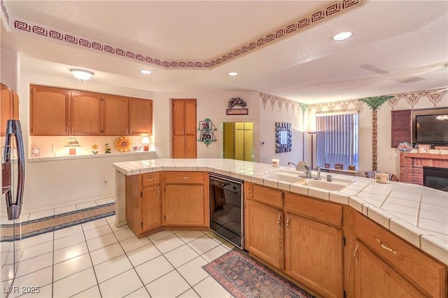 kitchen featuring dishwasher, a sink, refrigerator, recessed lighting, and light tile patterned floors