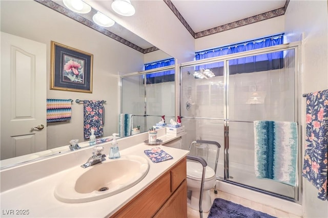bathroom featuring a shower stall, toilet, and vanity