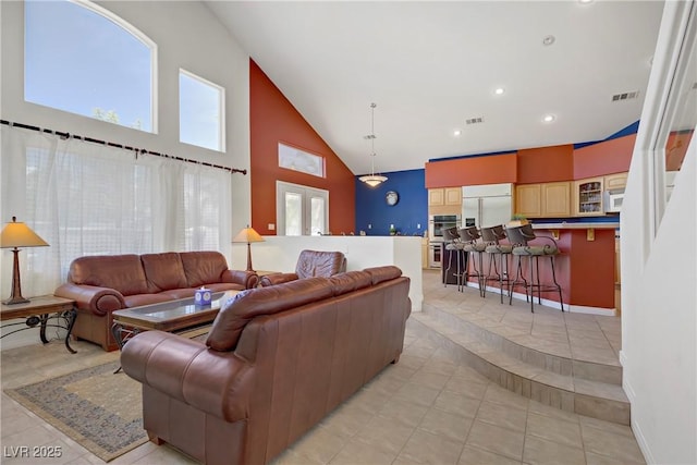1421 Via Savona Dr, Henderson, NV 89052 - living room featuring high vaulted ceiling, light tile patterned flooring, baseboards, and recessed lighting
