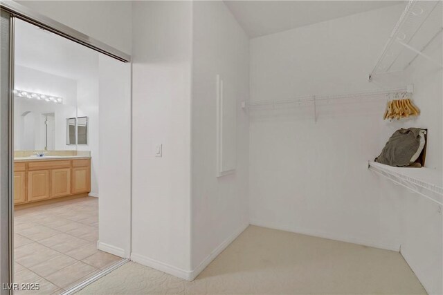 walk in closet featuring light tile patterned floors