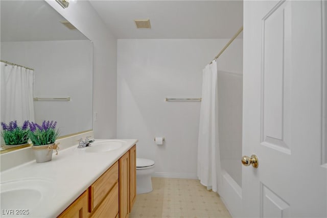 bathroom with double vanity, visible vents, a sink, tile patterned floors, and toilet