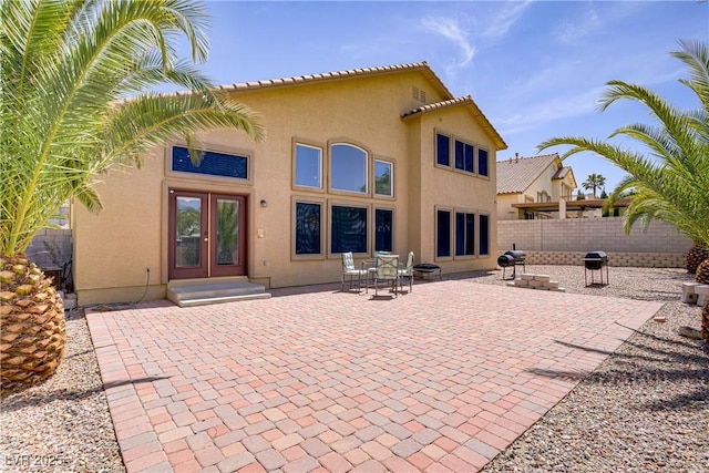 1421 Via Savona Dr, Henderson, NV 89052 - back of house with stucco siding, fence, and a patio area
